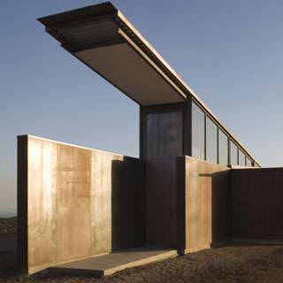Montecito Residence exterior featuring weathered exposed structural steel