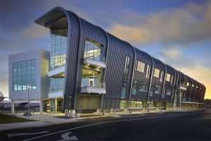 Raisbeck Aviation High School exterior featuring signature curved roof