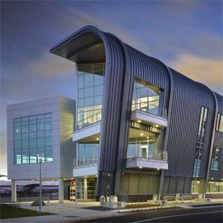 Raisbeck Aviation High School exterior featuring signature curved roof