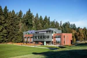 Saint Martin's University Cebula Hall far view with solar panels and featuring the juxtaposition of metal and brick sideing