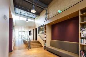 Bay Terrace Community Center interior hall featuring metal ceiling and reading nook