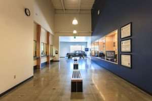 Kirkland Public Safety Building interior hall with classic car