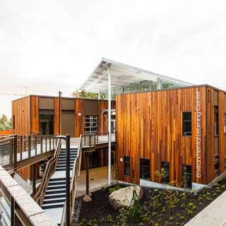 SAMi Environmental Learning Center exterior under pedestrian walkway at Point Defiance Park, Tacoma, Washington