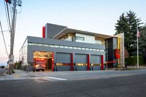 Seattle Fire Station 32 exterior view showing four bays one open with truck