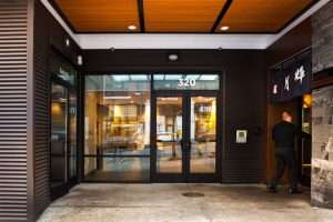 Three20 Apartments exterior entrance featuring mixed-texture surfaces