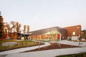 Eastside Community Center in Tacoma, exterior view of swimming pool at dusk. 