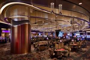 Emerald Queen Casino large gaming area featuring large wave-form lighting display