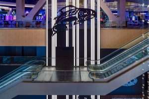 Emerald Queen Casino interior escalator featuring tribal salmon art