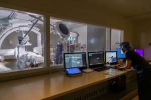 Harborview Medical Center Bi-Plane Operating Room from computer room showing imaging displays on computer screens