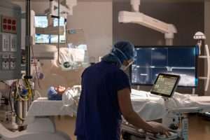 Harborview Medical Center Bi-Plane Operating Room with close-up of imaging technician and equipment