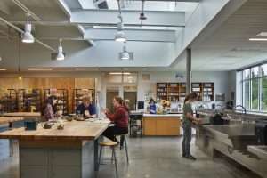 Bainbridge Island High School art classroom with students doing pottery