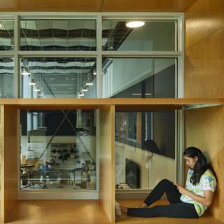 Bainbridge Island High School student reading in a cubby