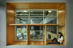 Bainbridge Island High School student reading in cubby