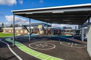 Grant Center for the Expressive Arts exterior covered play area with graphic paths, Tacoma, WA