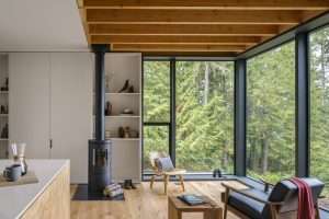 Little House interior living room with wood stove, Seabeck, WA