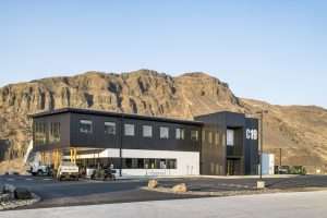 Chelan County PUD Rock Island Maintenance Facility exterior against hills, Malaga, WA