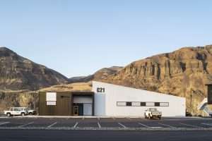 Chelan County PUD Rock Island Maintenance Facility exterior against hills, Malaga, WA