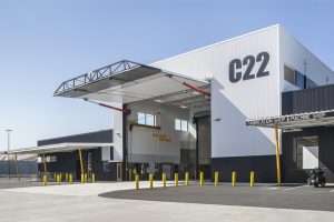 Chelan County PUD Rock Island Maintenance Facility exterior featuring enormous garage door with pneumatic openers, Malaga, WA