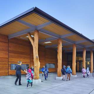 Blakely Elementary School exterior with tree trunk columns, Bainbridge Island, WA