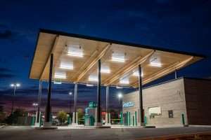 WSECU Building exterior at night time, showing drive-through canopy illuminated by lights.