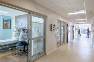 A hallway lined with patient rooms.