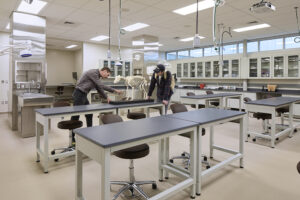 A vet lab classroom with workbenches and fume hoods on the far wall.